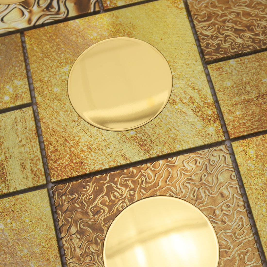 Gold circle mirror accents with textured aluminum mosaic tile patterns