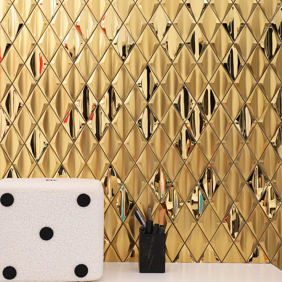 Gold diamond metal mosaic tile feature wall in a modern interior