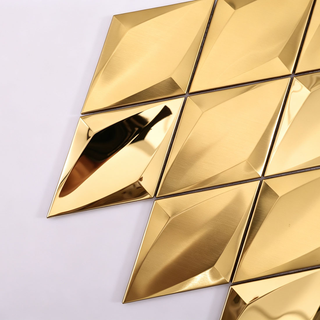 Corner detail of gold diamond metal mosaic tiles