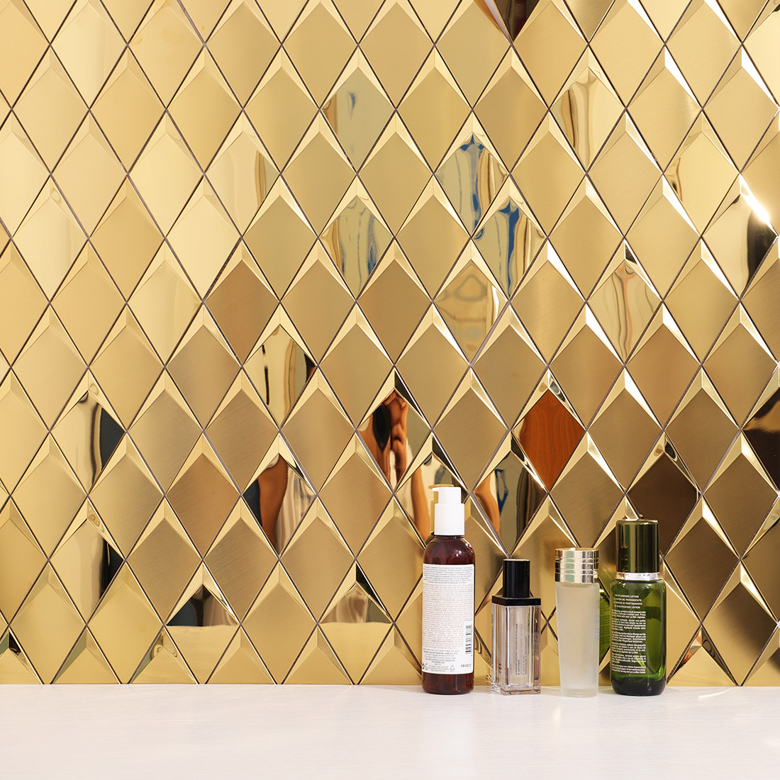 Gold geometric metal mosaic tile wall in a luxury bathroom