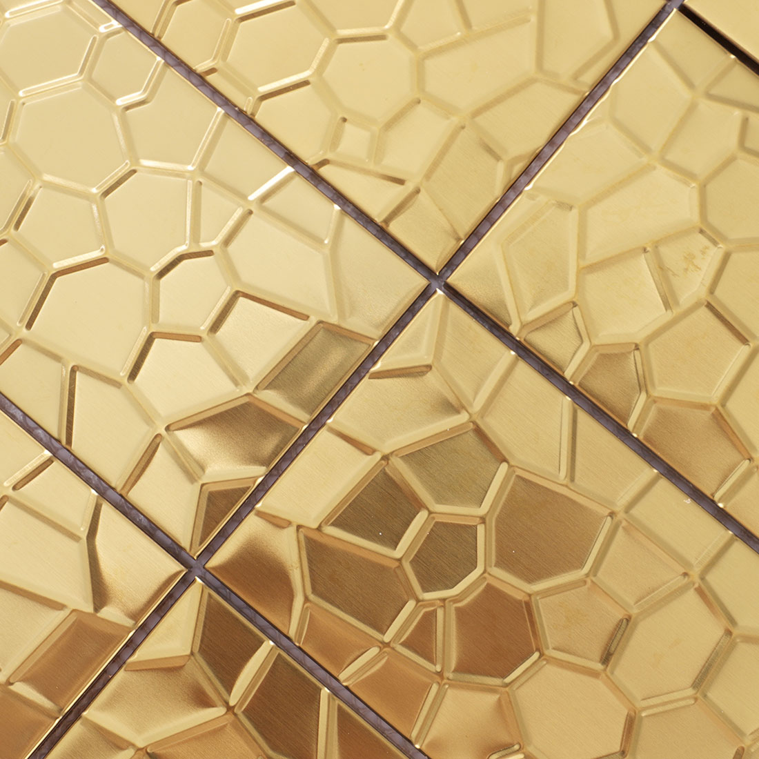 Close-up of gold geometric rectangle metal tile embossed surface