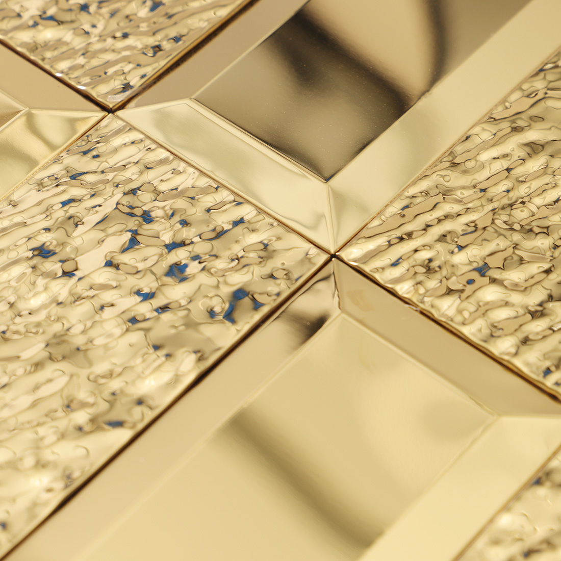 Close-up of gold hammered and polished rectangle metal mosaic texture