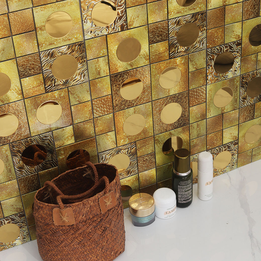 Gold textured aluminum mosaic tile creates a bold powder room accent wall