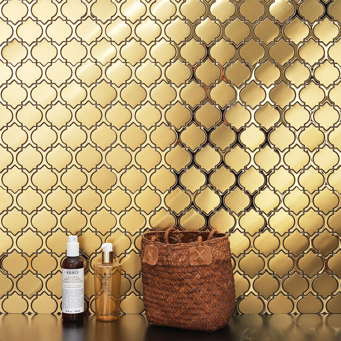 Gold arabesque metal vanity wall tile with woven basket decor