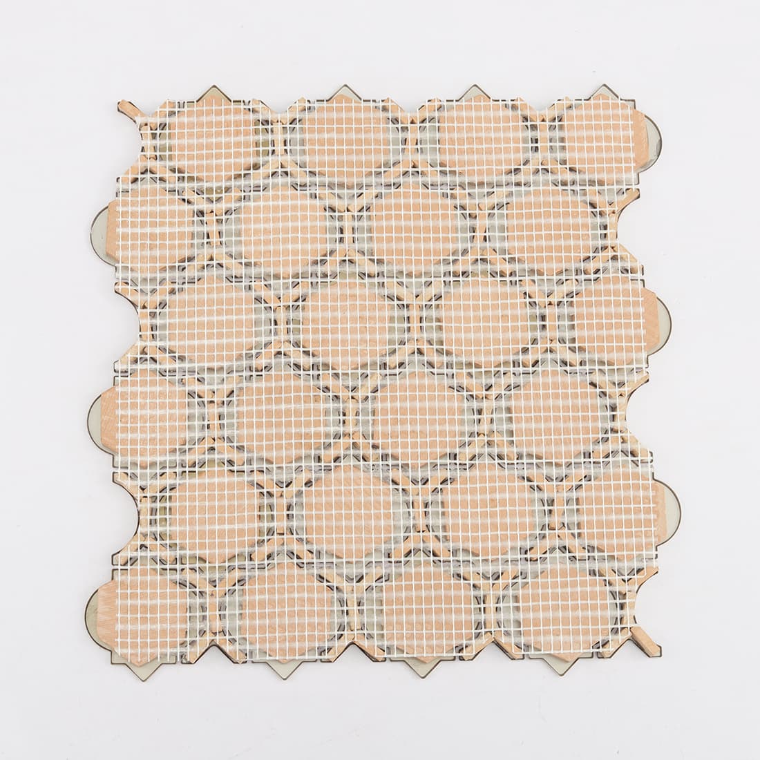 Back view of gold metal mosaic tile with white mesh mounted backing