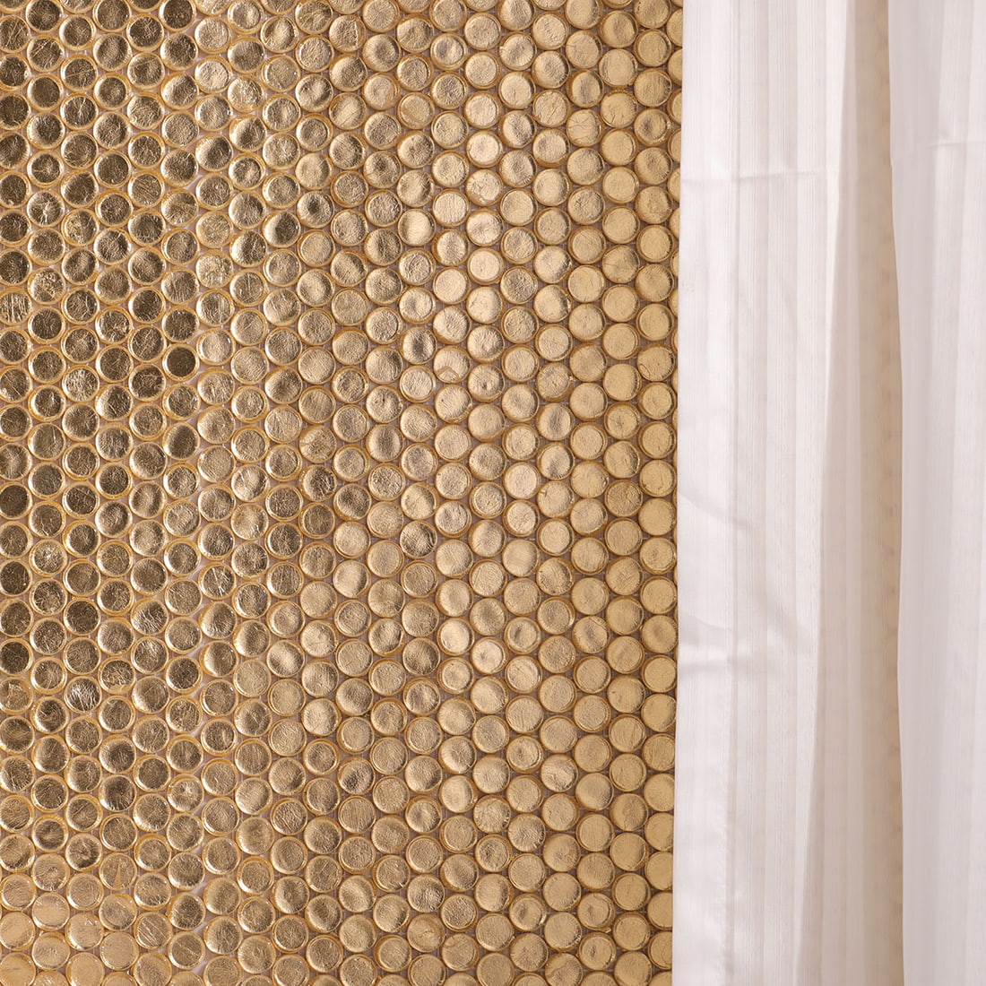 Gold penny round glass mosaic tiles installed on bathroom wall