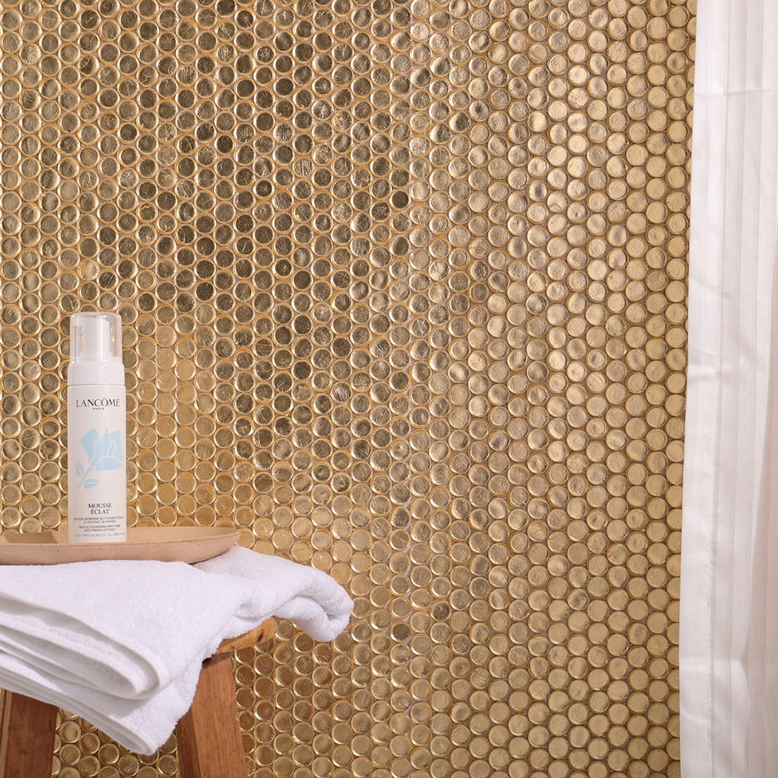 Gold penny round glass mosaic tiles installed on luxury shower wall
