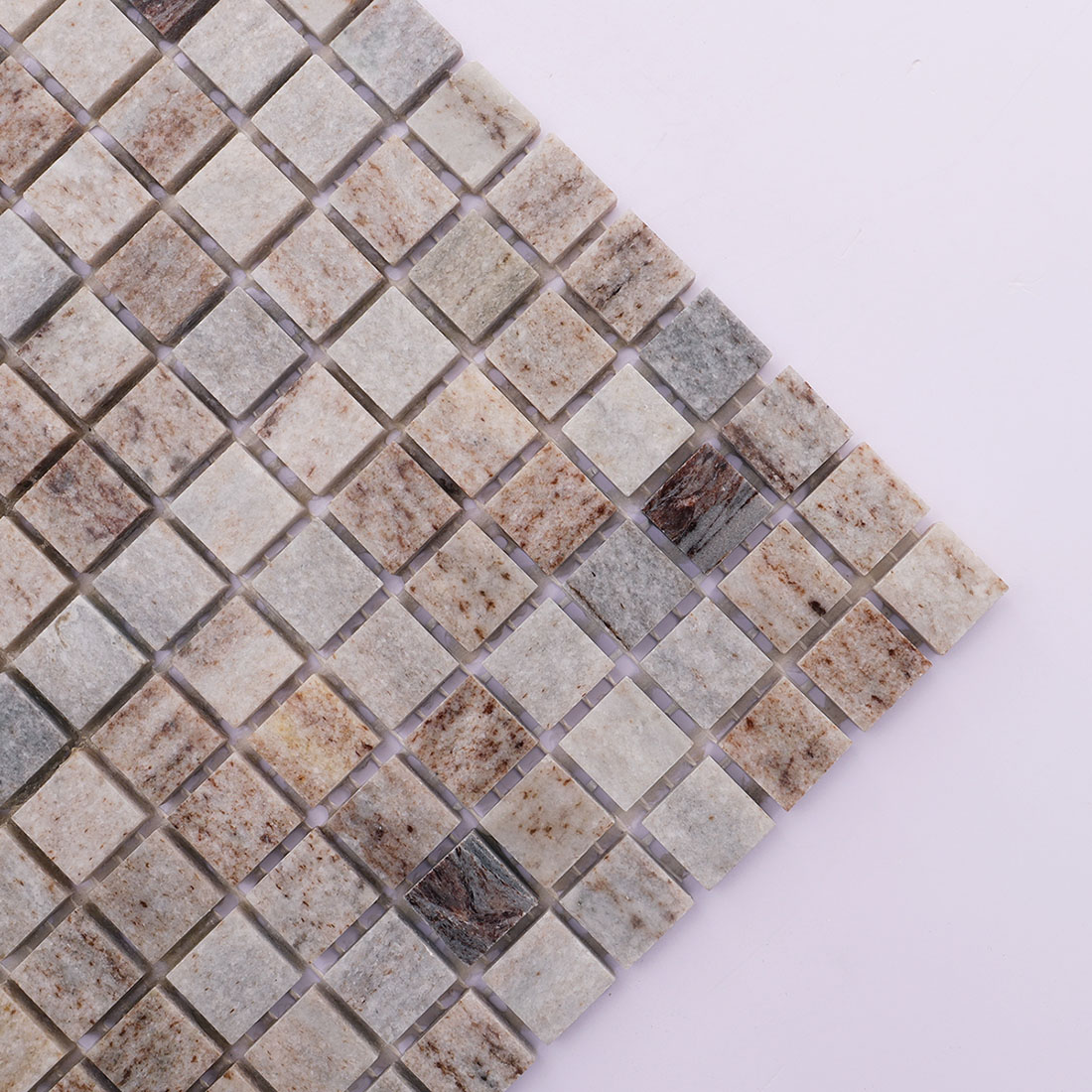 Corner detail of gray brown square marble mosaic tile with natural variation