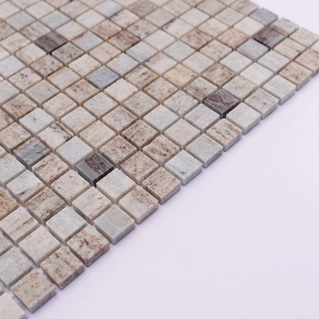 Side edge of gray brown square marble mosaic tile with a natural stone finish