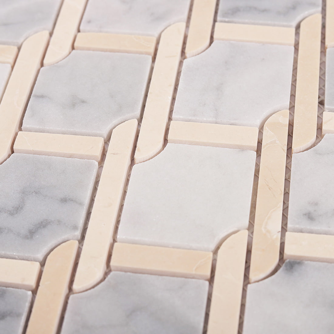 Close up of interlocking chain link pattern with gray marble squares and beige links