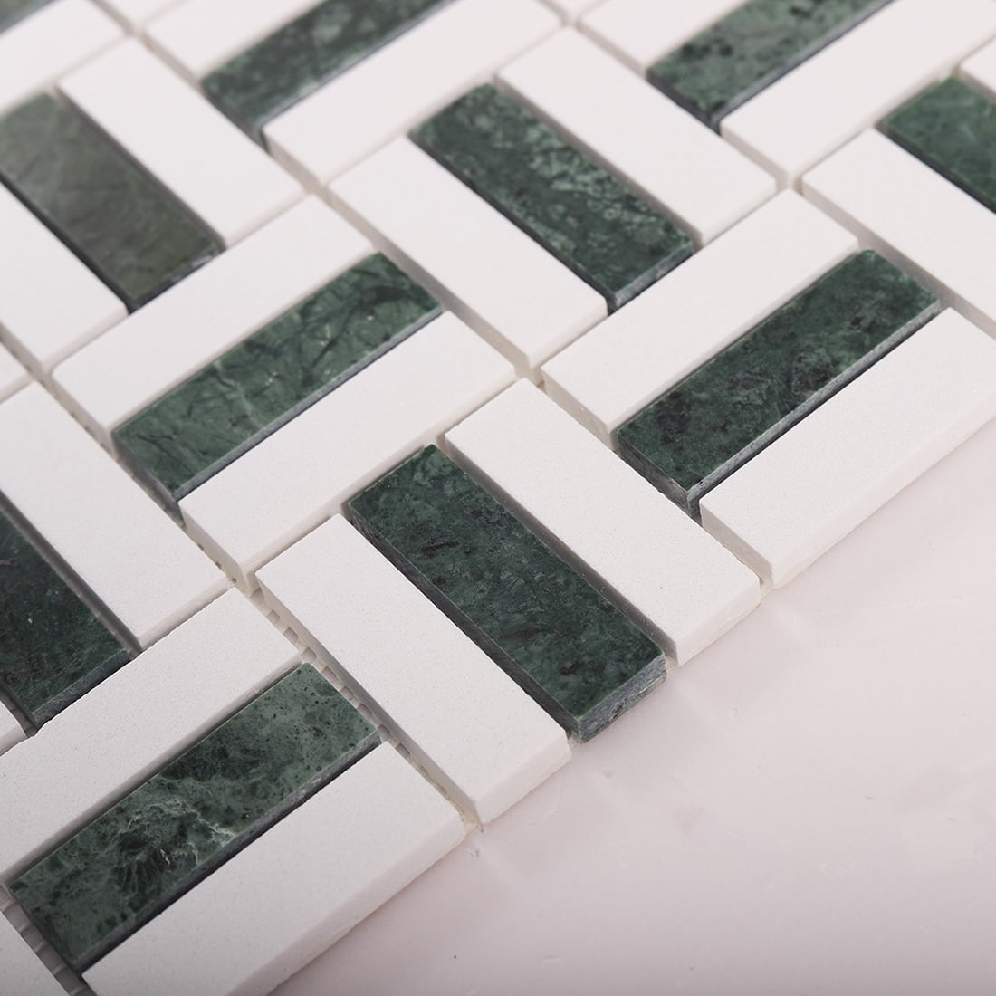 Close-up of tile sheet edge showing thickness, spacing, and surface finish