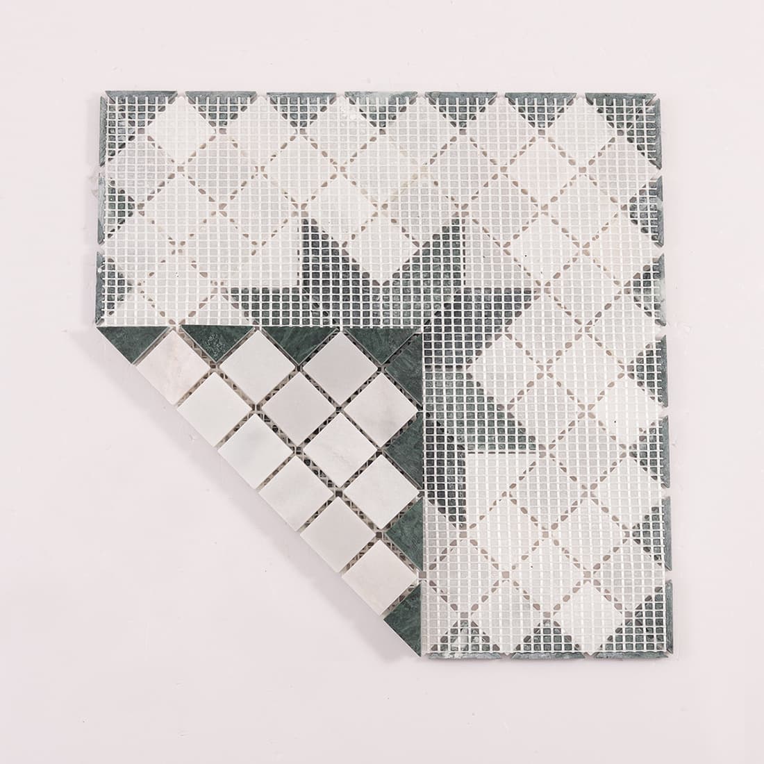 Back view of green marble and Carrara white star mosaic tile with mesh backing