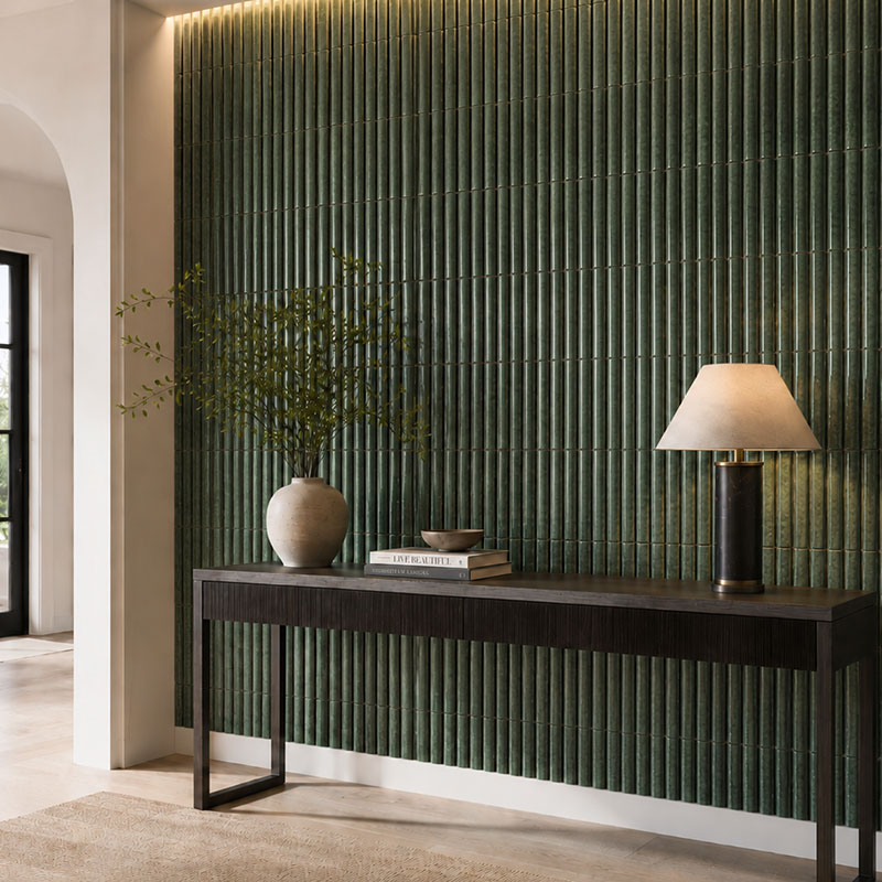 Green fluted wall tiles behind a console table in a modern living room