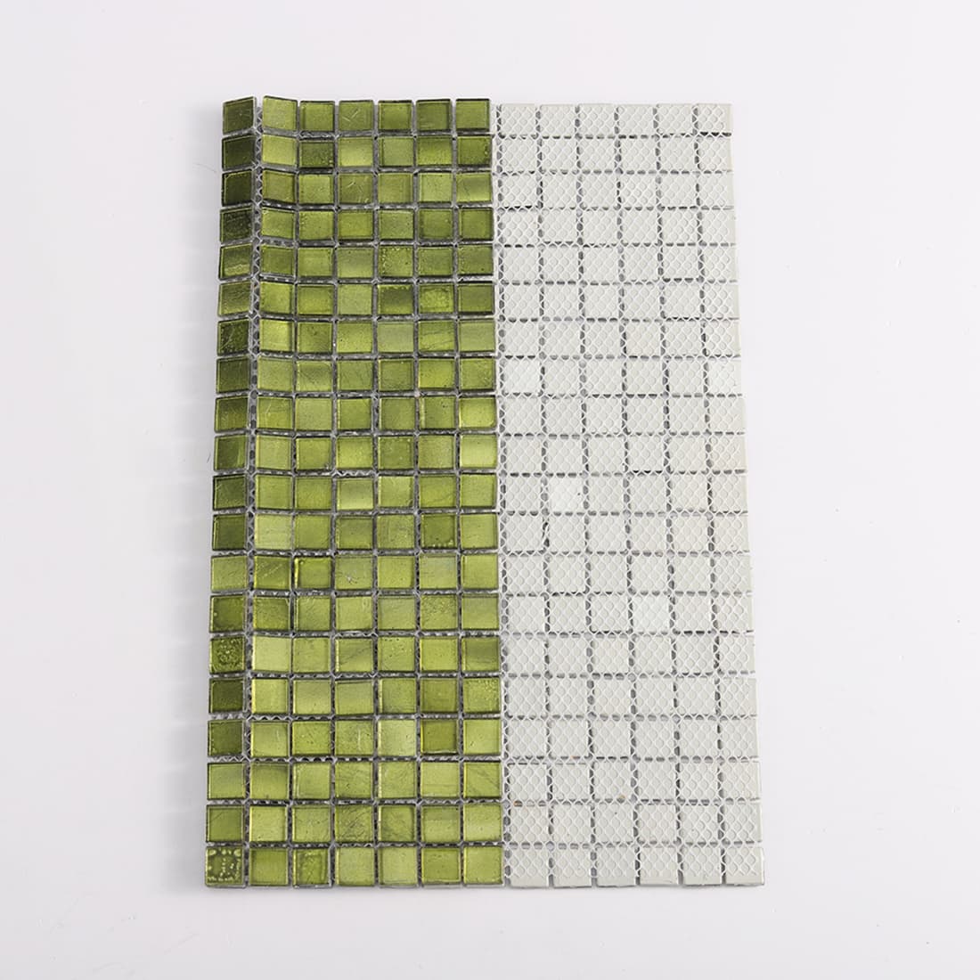 Side view of green glass mosaic tile sheet showing front tiles and mesh backing