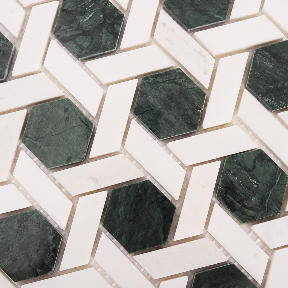 Close up of green hexagon weaved marble mosaic showing natural stone texture