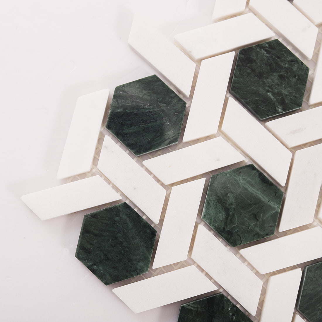Corner detail of green hexagon and white weave marble mosaic tile pattern