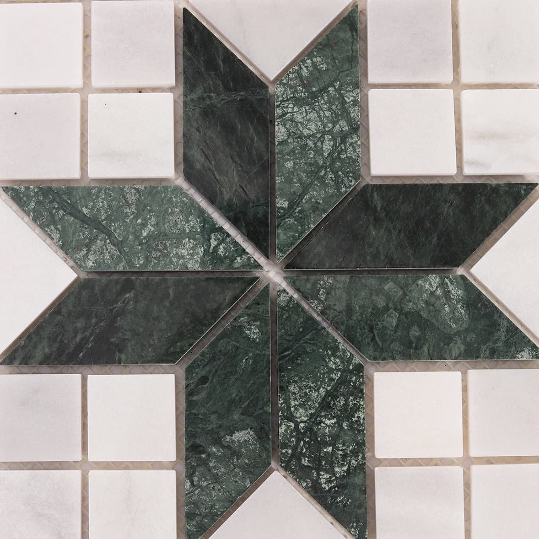 Close up of green marble and Carrara white star shaped mosaic tile center