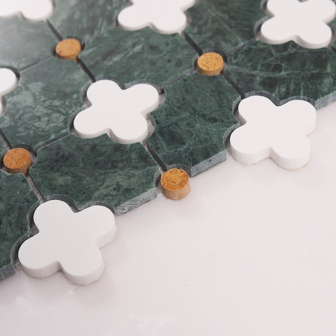 Side view close up showing mosaic tile edge thickness with white clover pieces