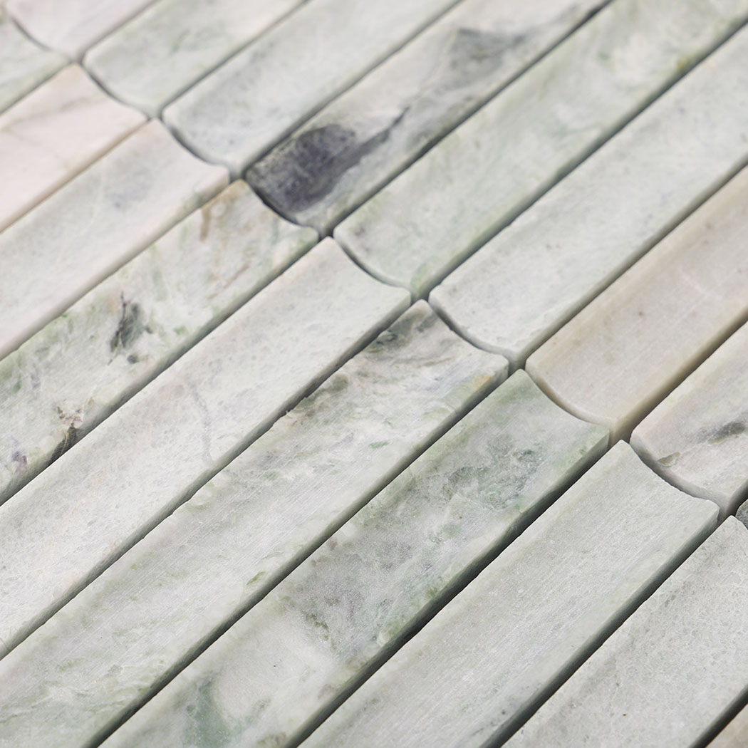Pale green marble vertical strip mosaic showing varied gray stone markings