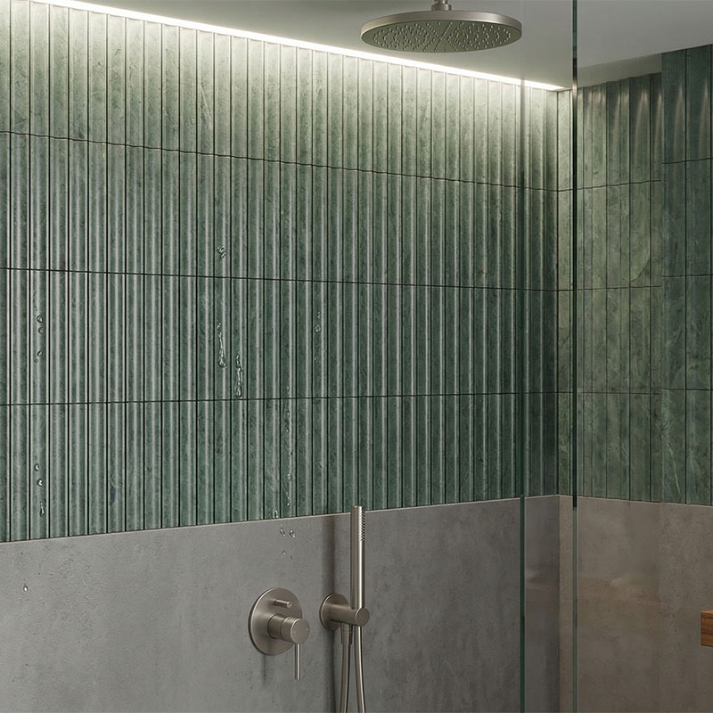 Luxury Green Marble Fluted Tile Shower With Modern Brushed Nickel Hardware.