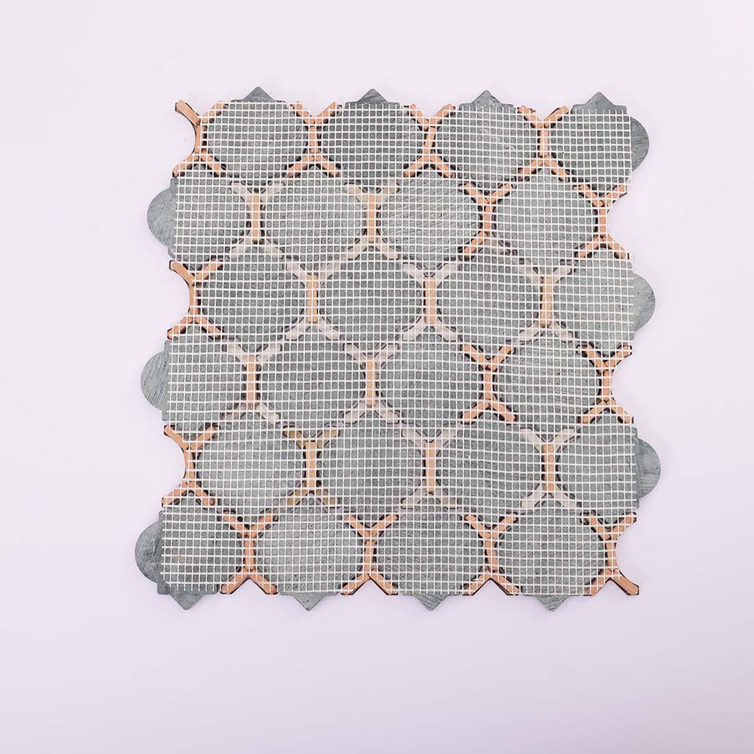 Mesh backing of green marble and gold stainless steel mosaic tile