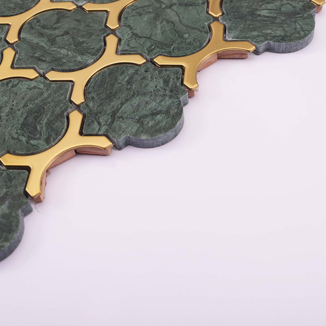 Side detail of green marble mosaic with raised gold stainless steel inlay