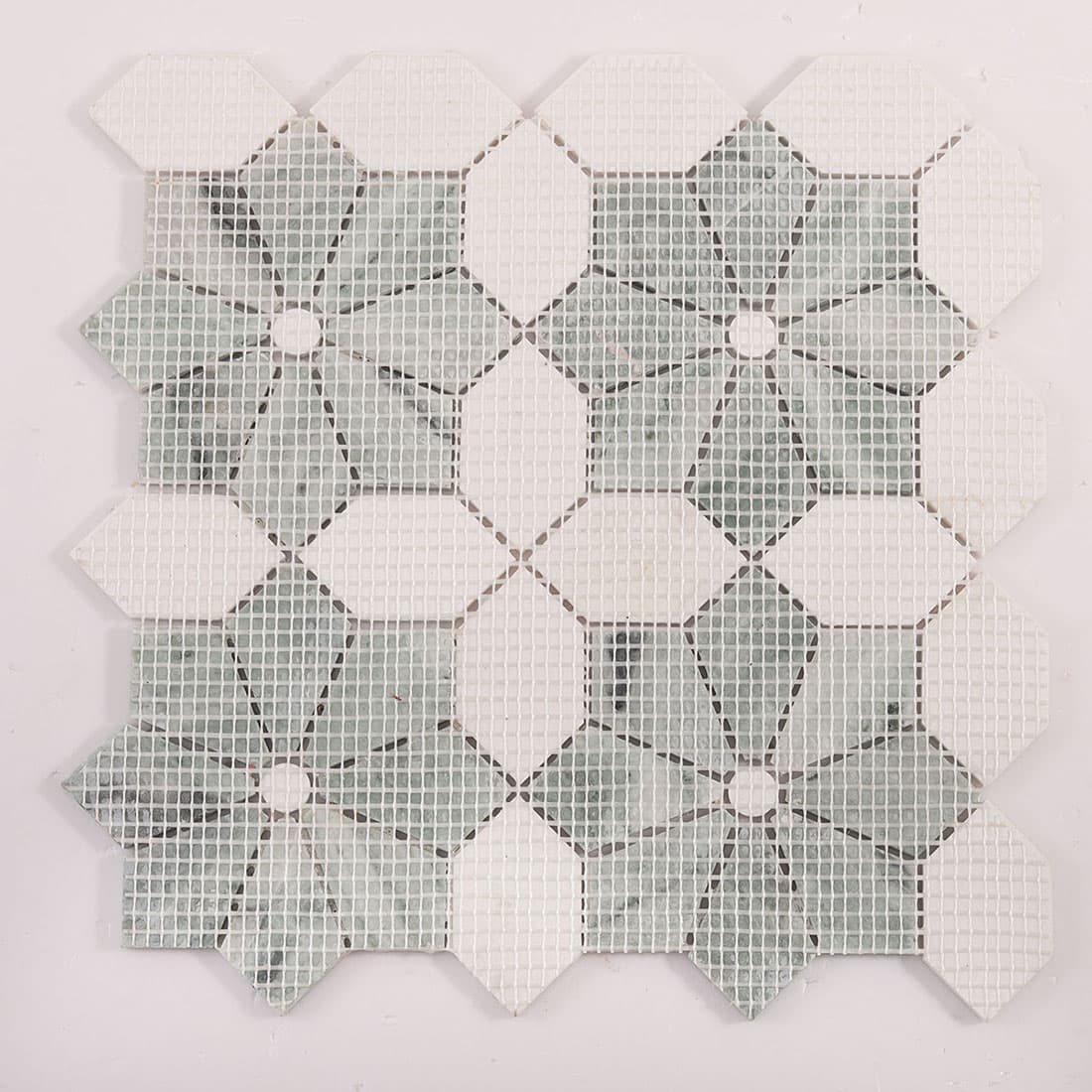 Back view of mosaic tile sheet showing mesh backing and layout