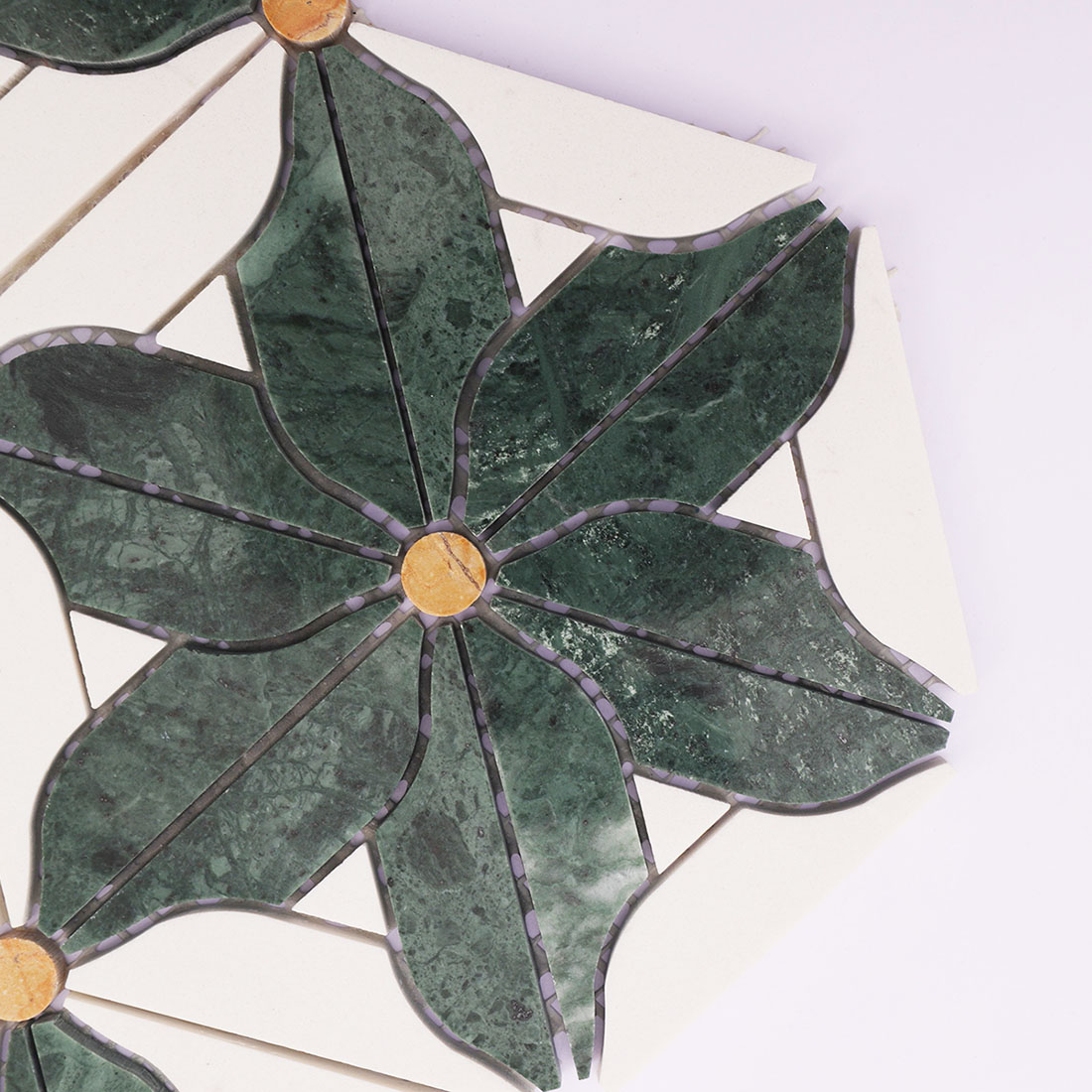 Close-up of green marble floral petals with white stone and yellow accents