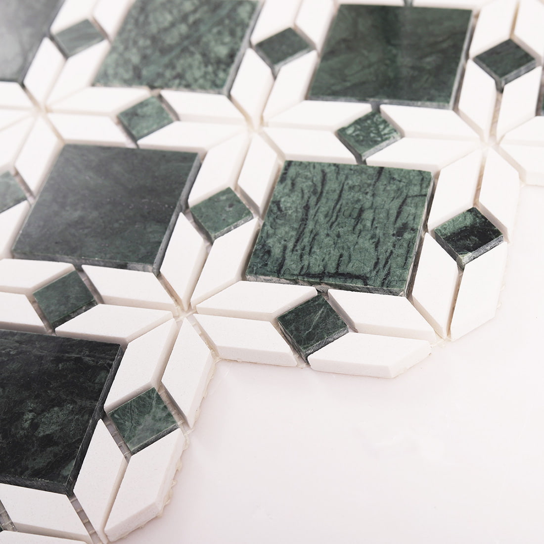 Angled view showing thickness of green and white marble flower mosaic tile