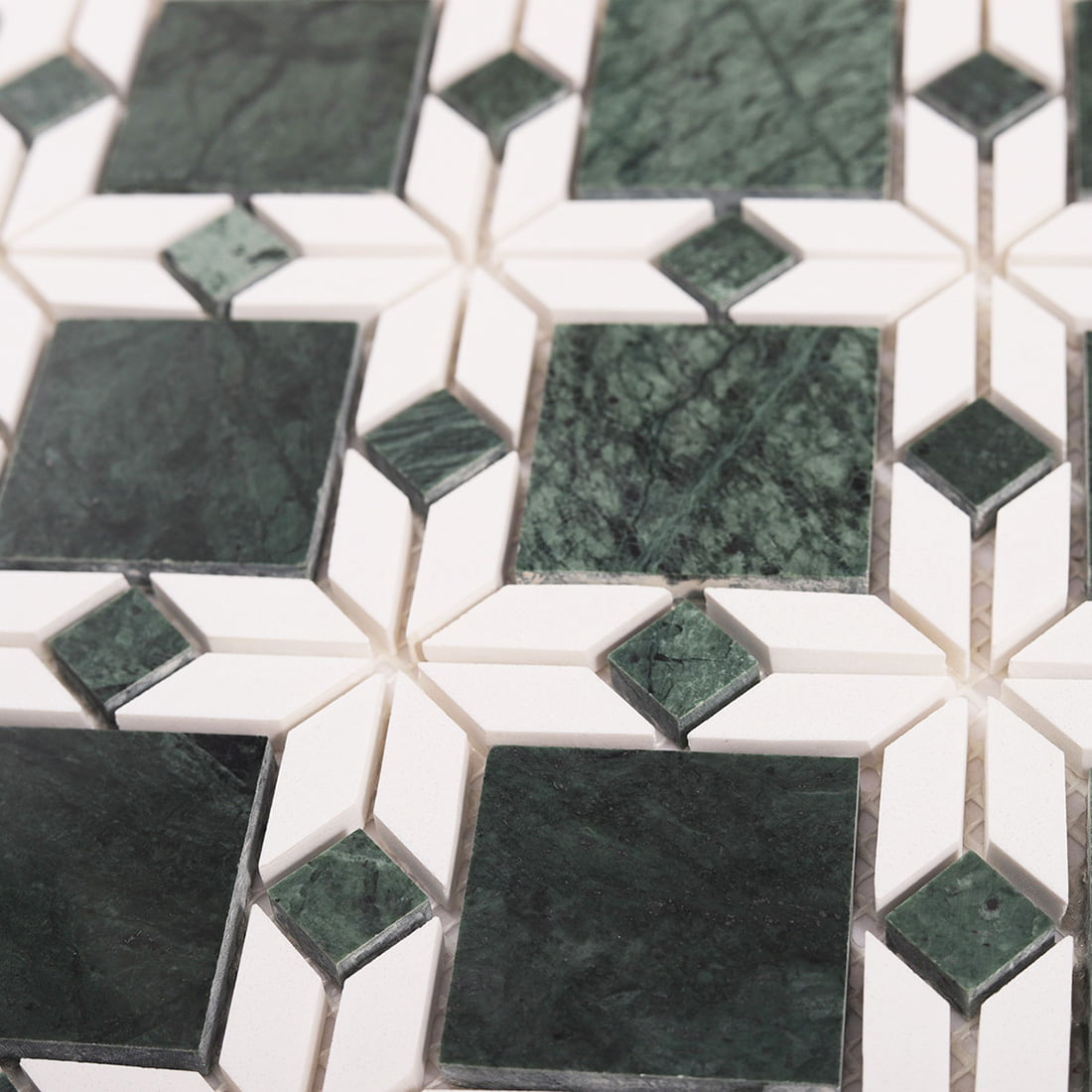 Close up detail of green and white marble flower mosaic tile texture