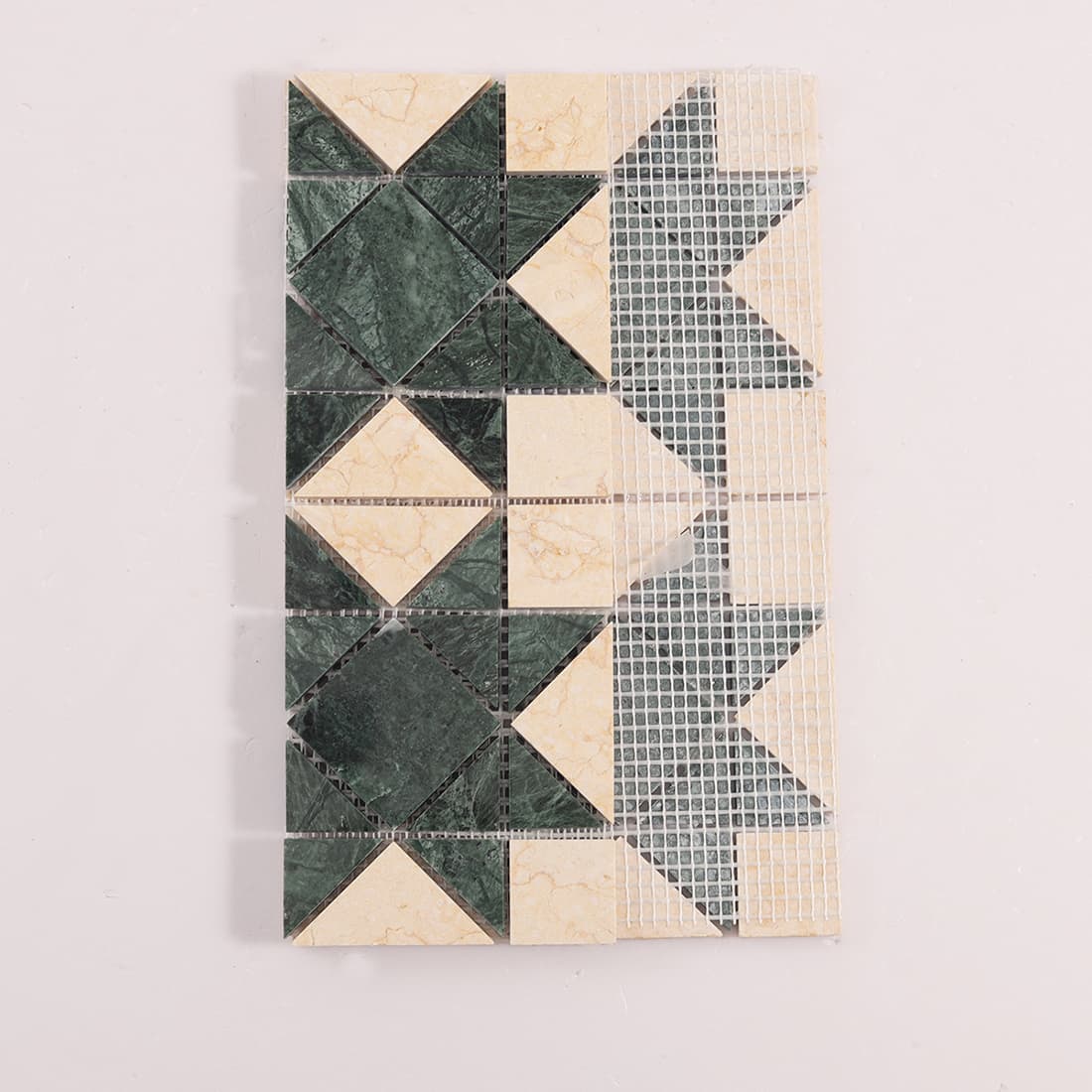 Back view of green and cream marble mosaic tile sheet showing mesh backing structure
