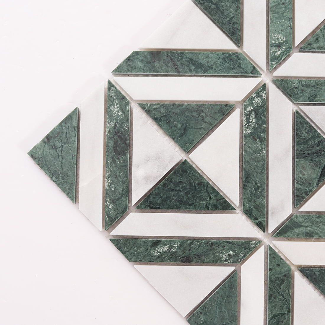 Green marble and white stone geometric mosaic close up detail