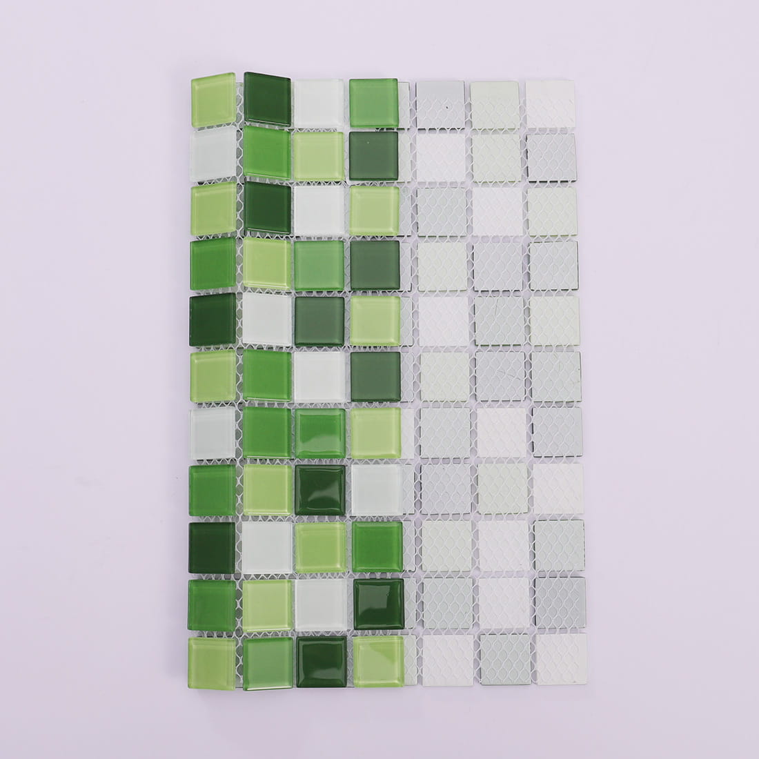Green and white square crystal glass mosaic tile showing mesh backing