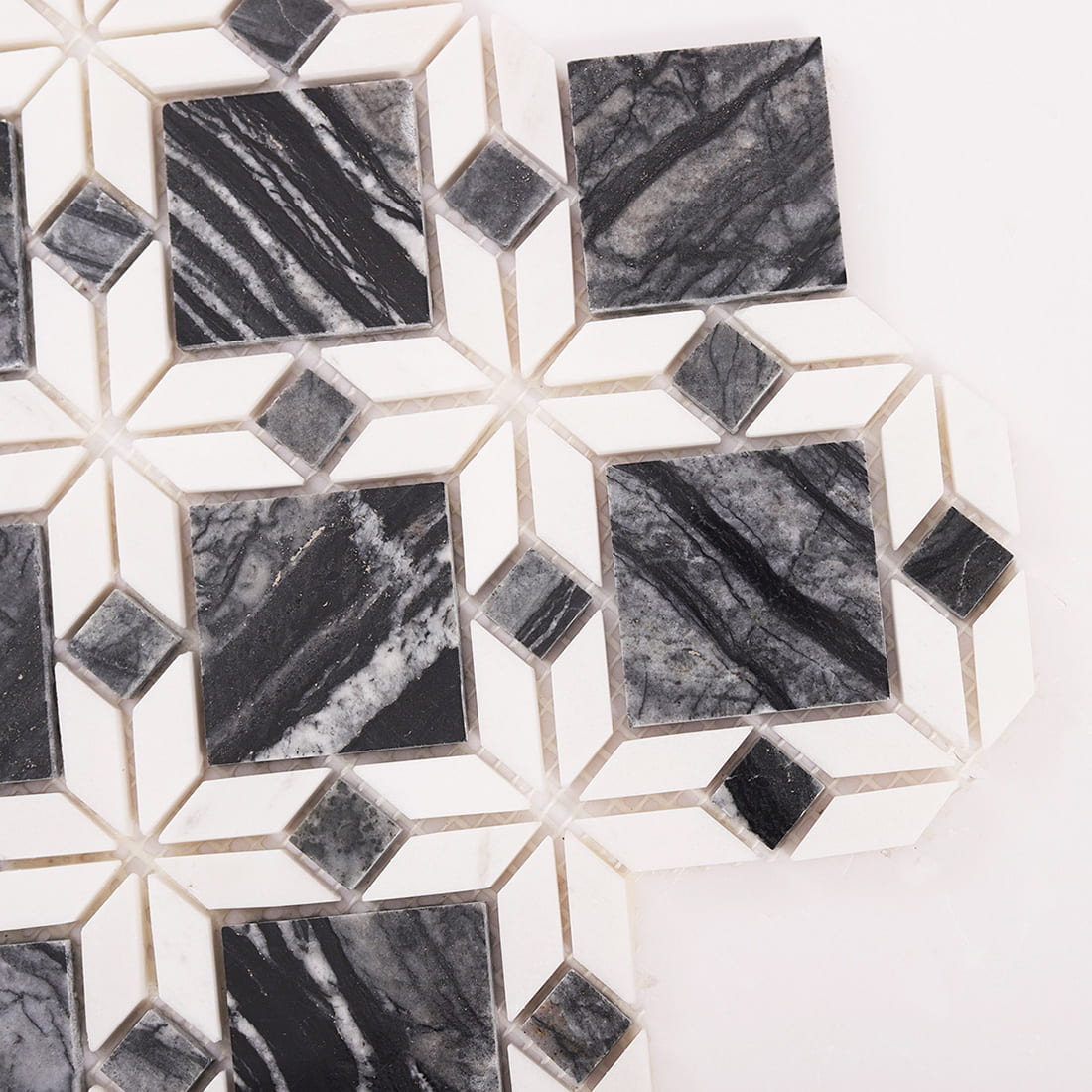 Close up of grey and white marble diamond mosaic tile corner detail