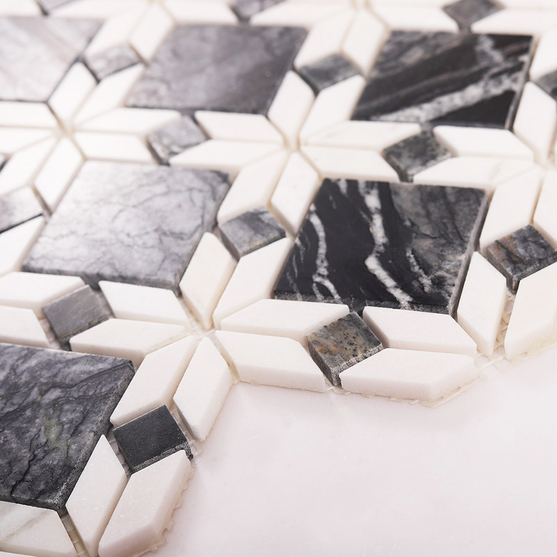 Side angle view showing thickness of grey and white marble mosaic tile