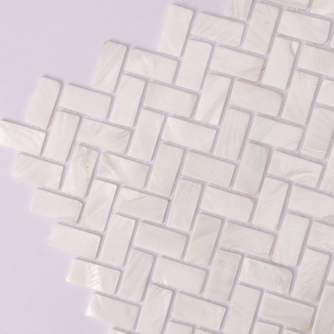 Close up of herringbone mosaic corner showing iridescent shell pieces
