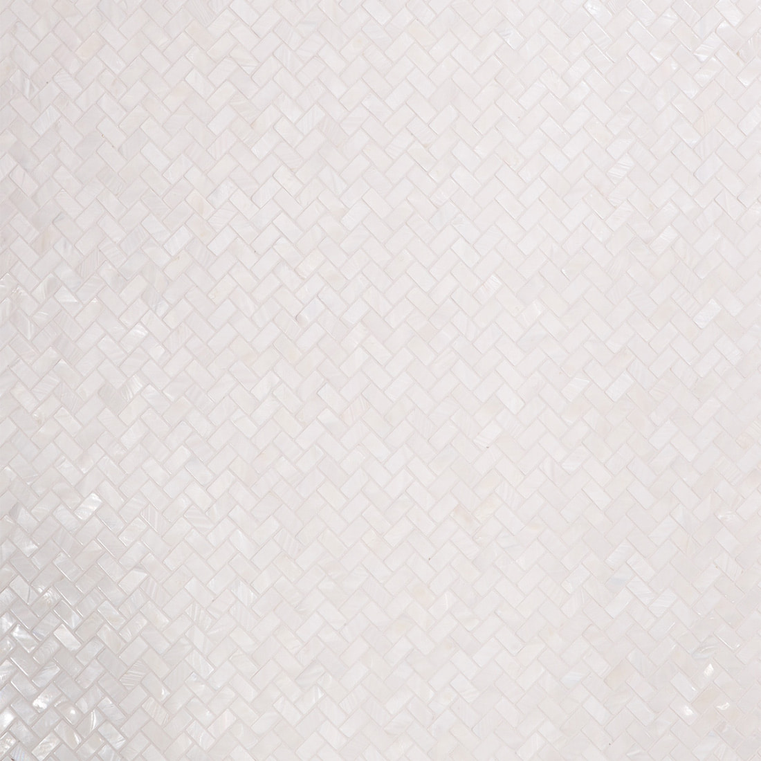 Detailed close up of white mother of pearl herringbone mosaic texture