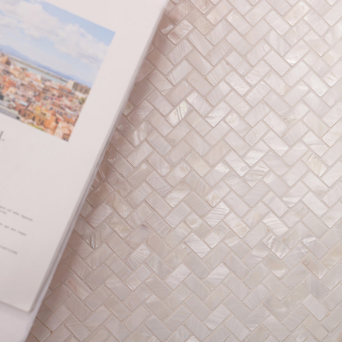 Top view of white mother of pearl herringbone mosaic texture pattern