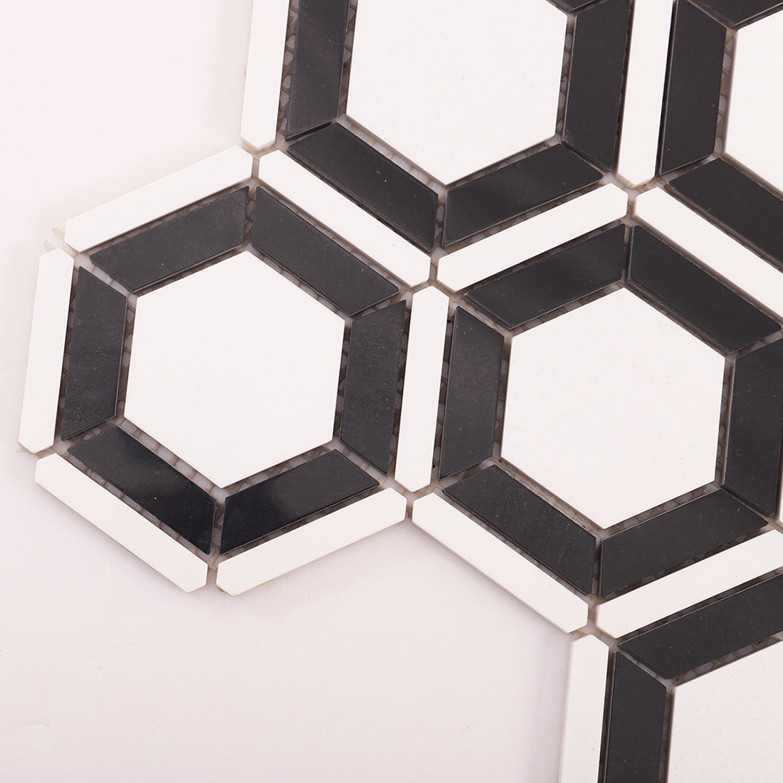 Close up of hexagon frame mosaic showing corner joints and grout gaps