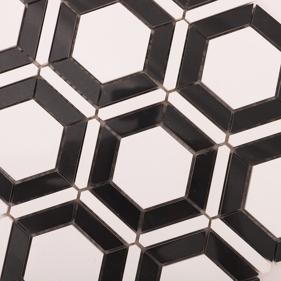 Detailed view of black frame and white hexagon mosaic pattern