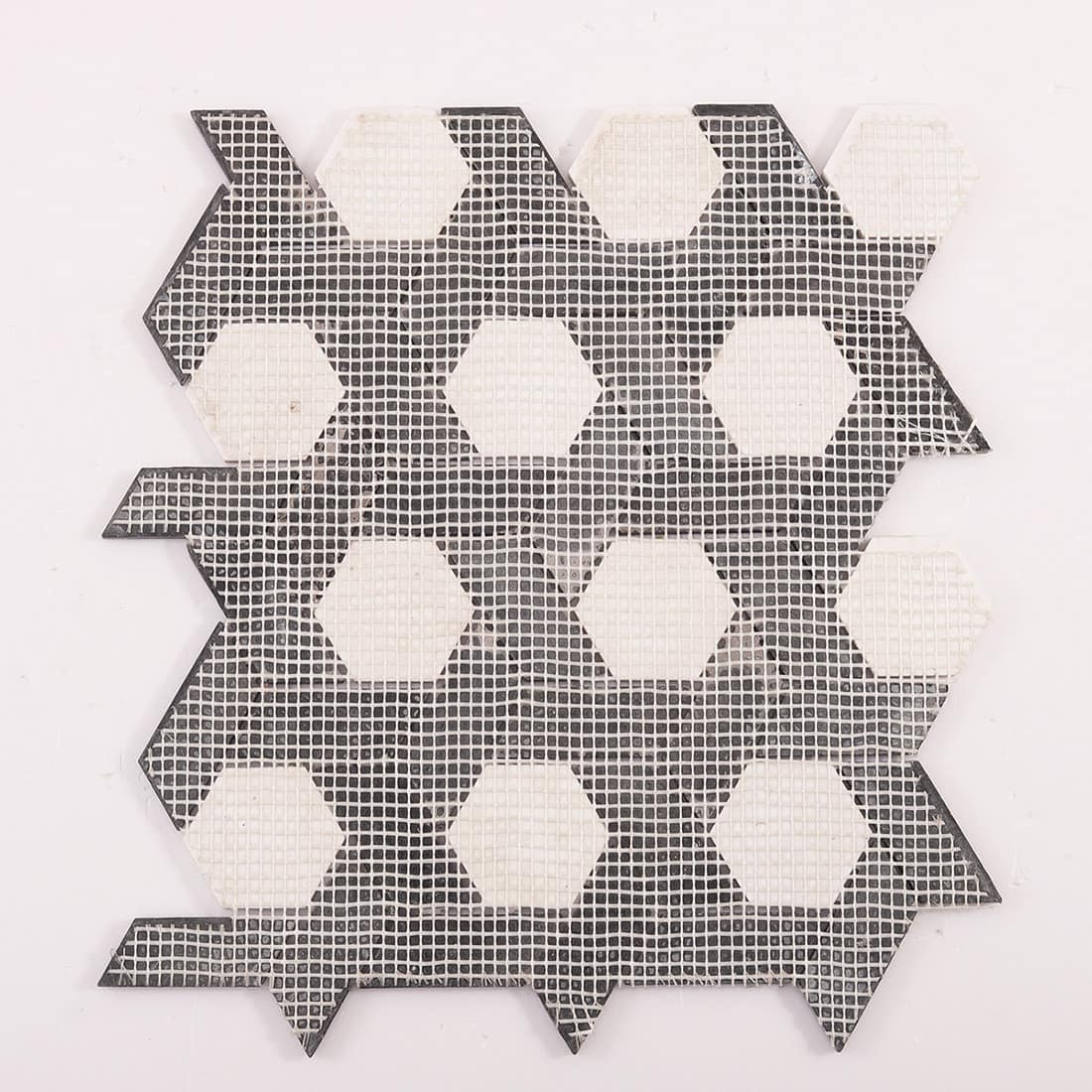 Back view of mosaic tile sheet with mesh backing