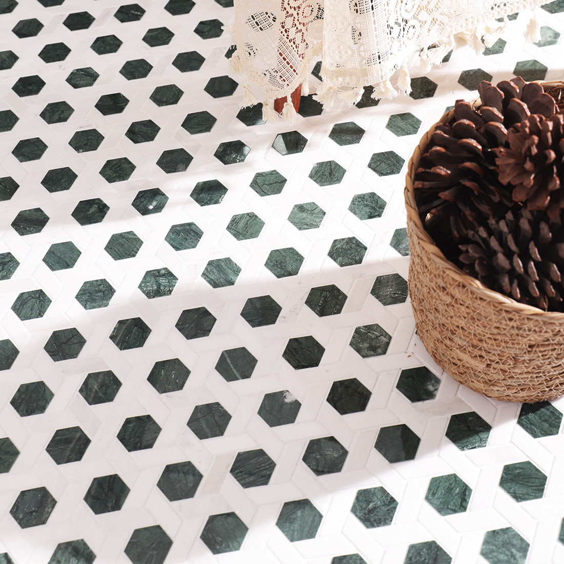 Top view of installed green hexagon mosaic floor with decorative basket styling