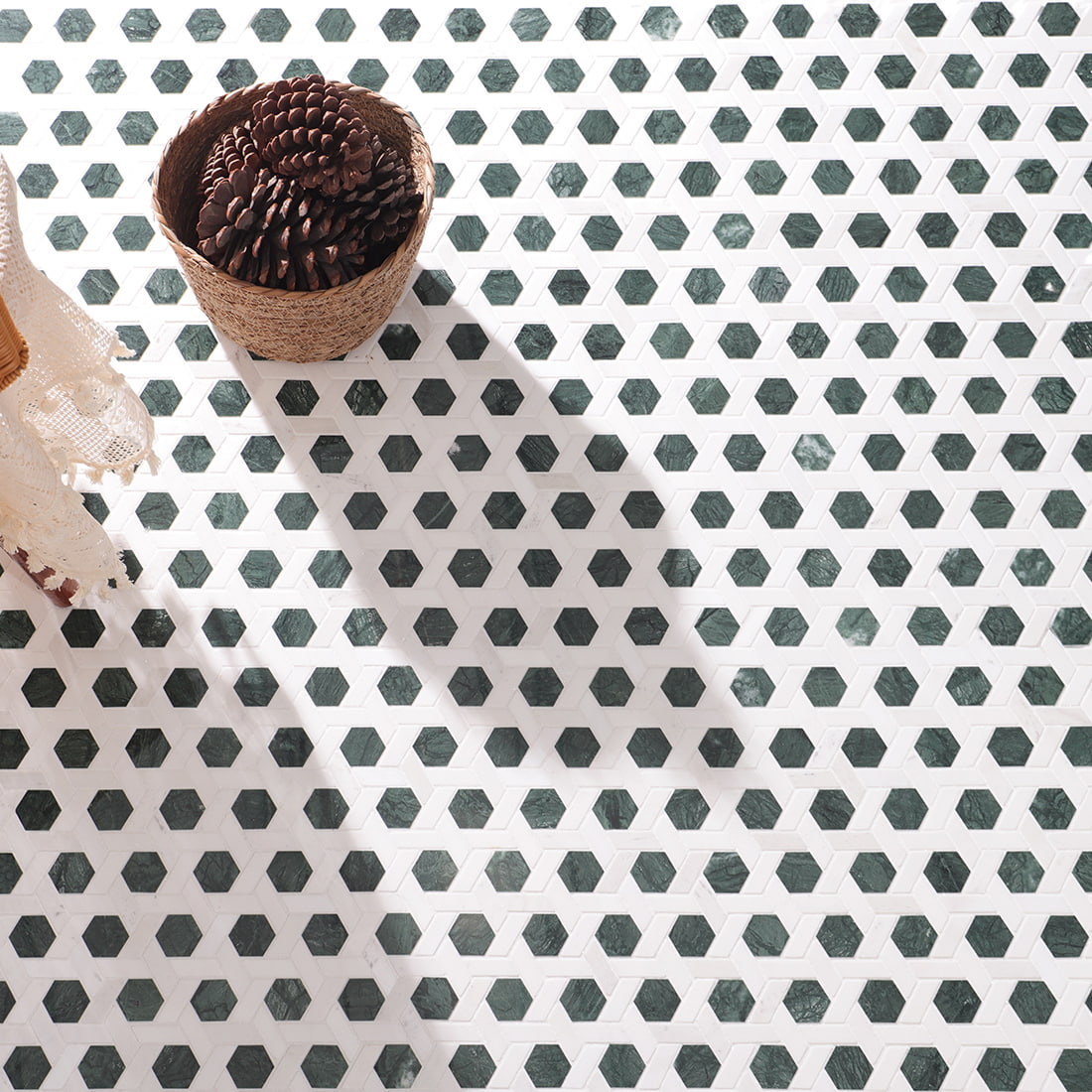 Close view of installed green hexagon mosaic floor showing texture and pattern