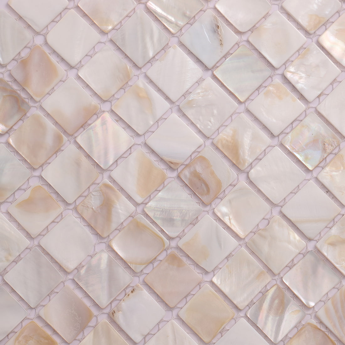 Closeup of iridescent mother of pearl tiles in diamond pattern