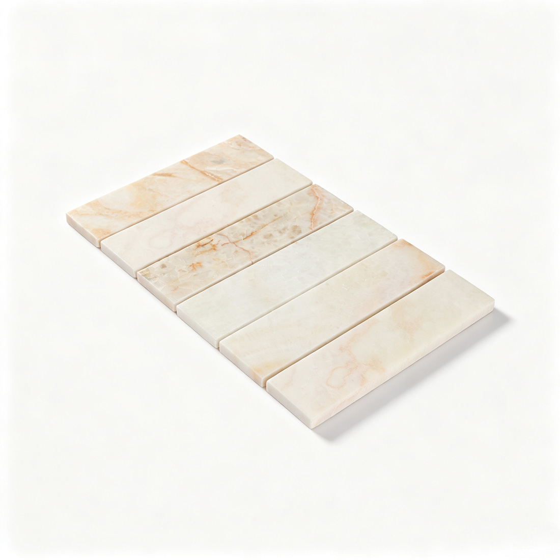Angled view of ivory onyx wide bar mosaic tile sheet