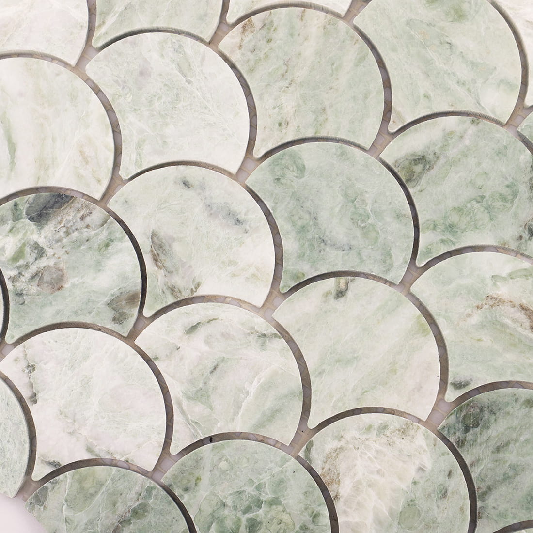 Detailed view of light green marble fish scale mosaic pattern with subtle color variation