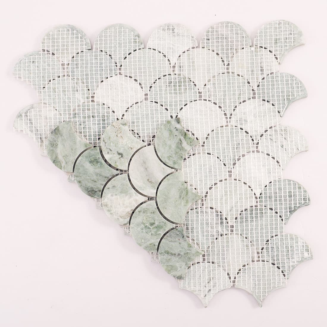 Back view of light green marble fish scale mosaic sheet showing mesh backing structure