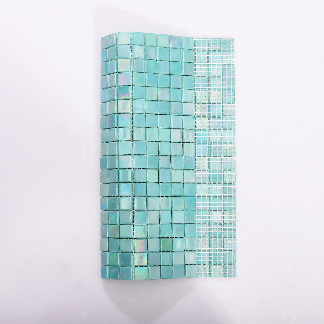 Curved sheet of light aqua iridescent square glass mosaic with mesh backing