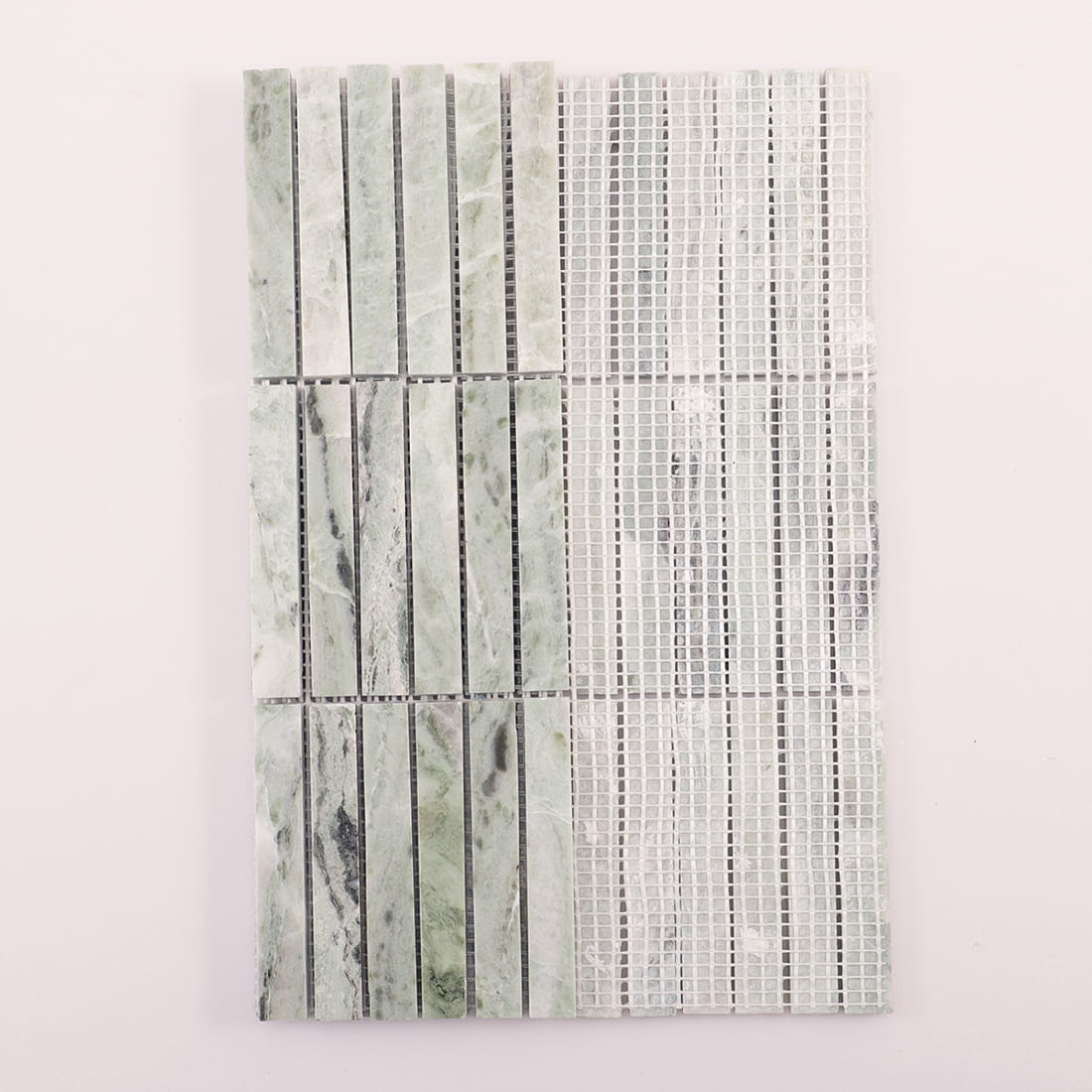 Back view of light green marble linear mosaic sheet showing mesh backing 