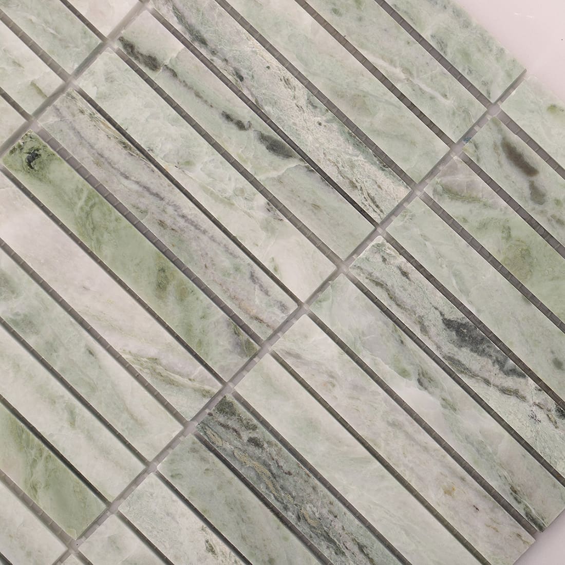 Closeup of light green marble mosaic surface with stacked strip pattern